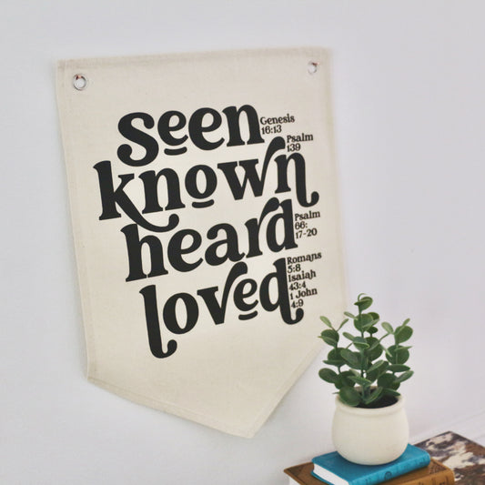 seen. known. heard. loved. natural canvas wall flag