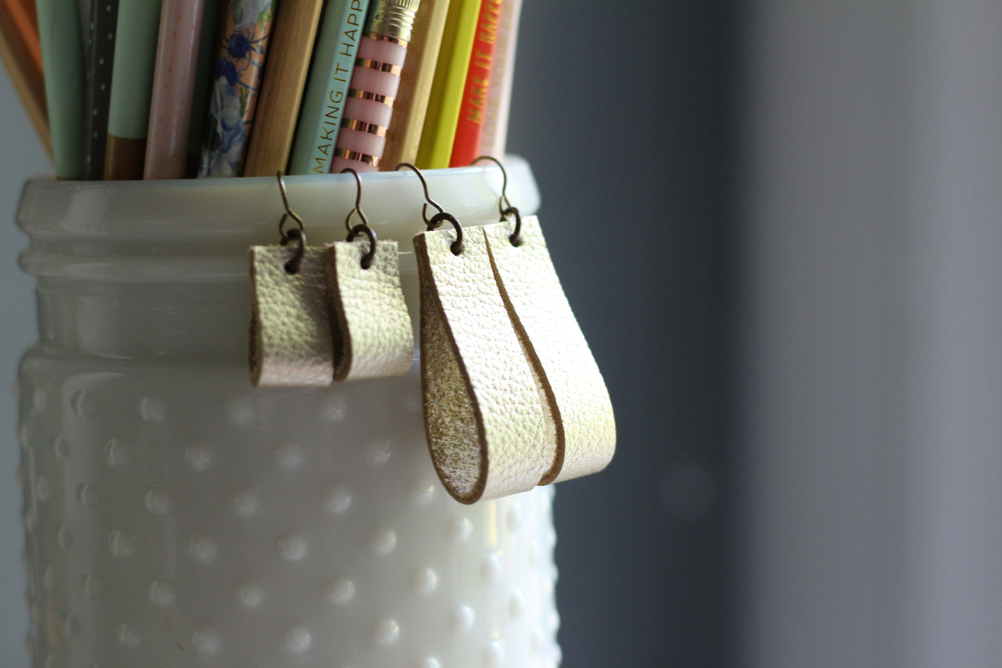 simple loop genuine leather earrings in metallic bronze