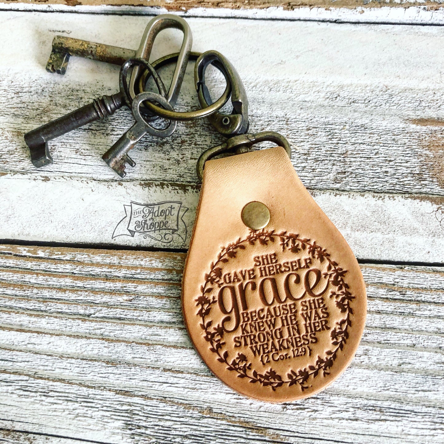 she gave herself grace because she knew He was strong in her weakness (2 Corinthians 12:9) leather key fob ring (camel/natural)