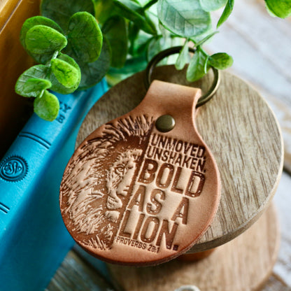 Unmoved. Unshaken. BOLD AS A LION. (Proverbs 28:1) leather keyring (camel/natural)