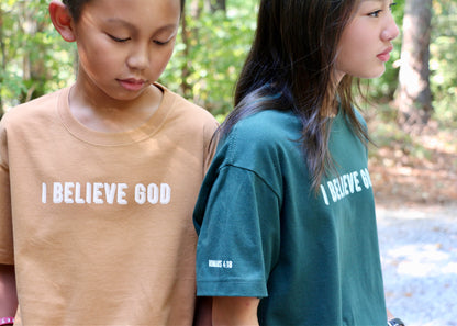 I believe God - against all odds unisex heavyweight cotton t-shirt