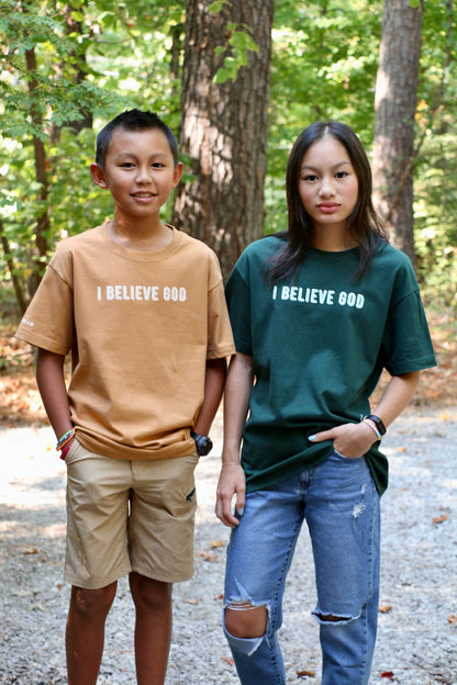 I believe God - against all odds unisex heavyweight cotton t-shirt