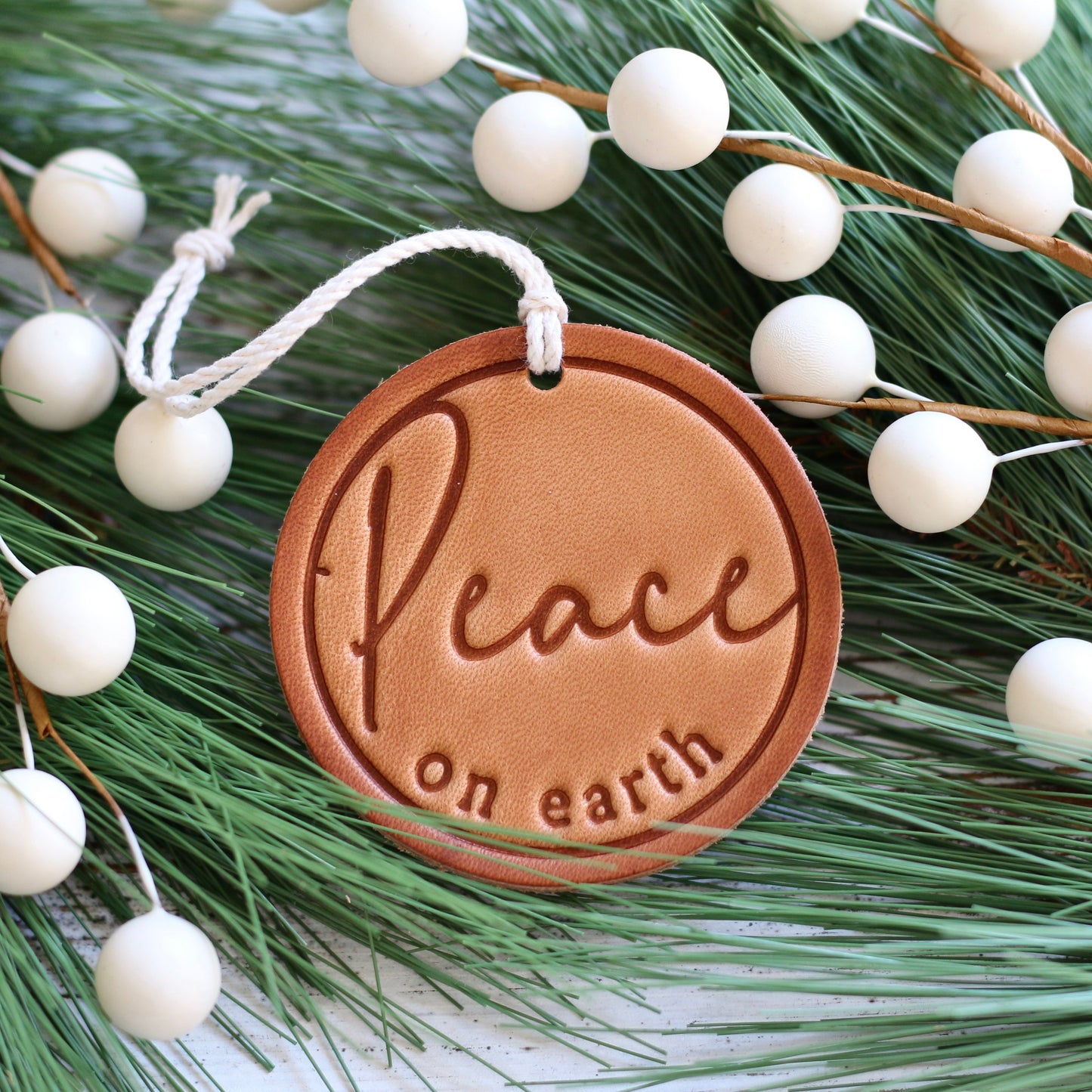 peace on earth - leather hand-stamped ornament