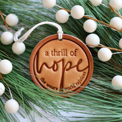 a thrill of hope - the weary world rejoices - leather hand-stamped ornament