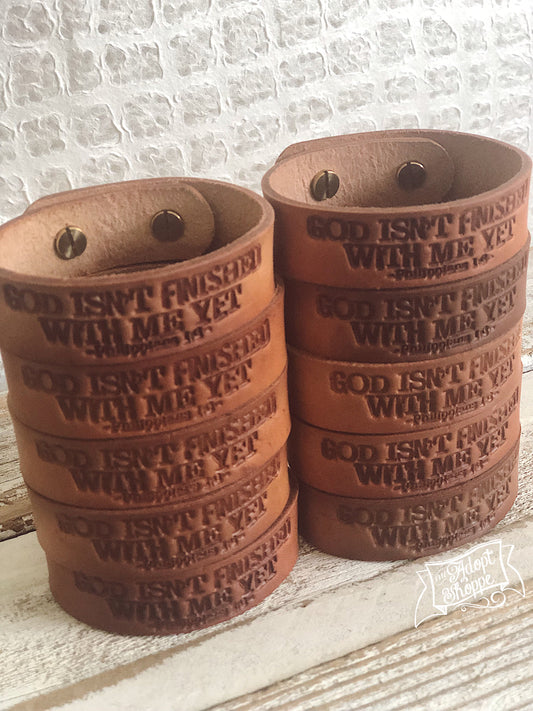 God isn’t finished with me yet (camel/natural) leather cuff