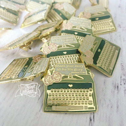 share your story - all for His glory (Romans 11:36) typewriter soft enamel pin (gold)