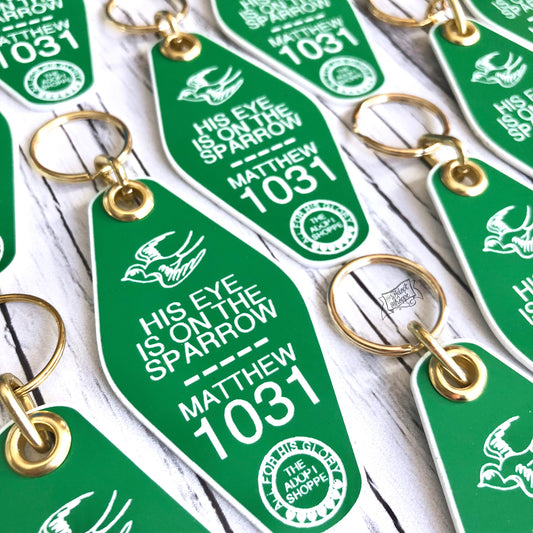 His eye is on the sparrow green retro motel key tag fob