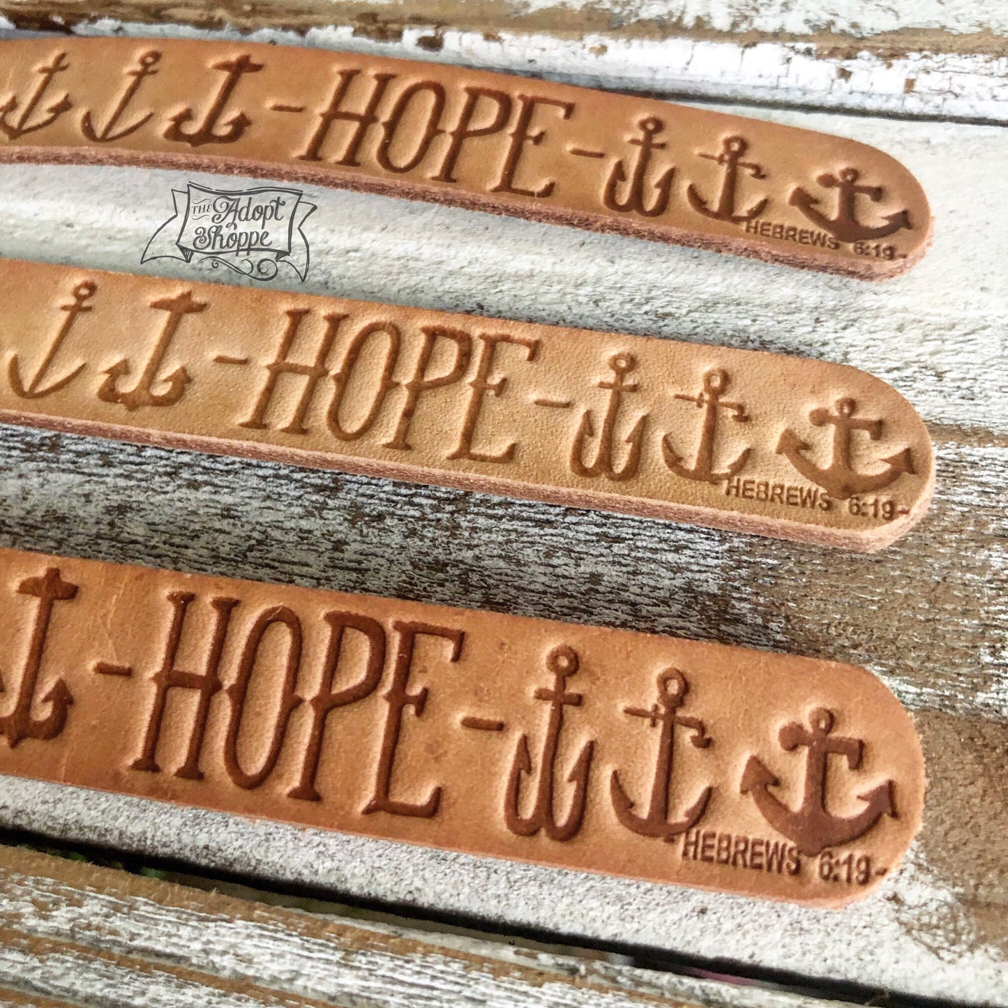 hope many anchors Hebrews 6:19 (camel/natural) leather tag