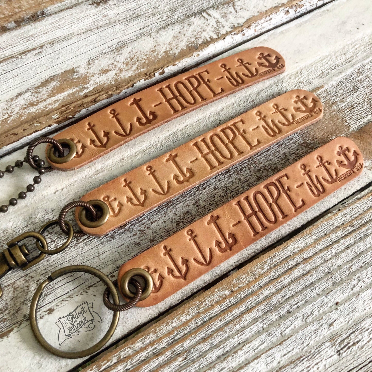 hope many anchors Hebrews 6:19 (camel/natural) leather tag