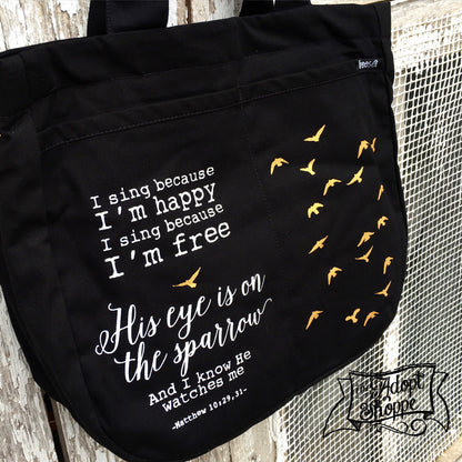 His eye is on the sparrow hymn gold foil black fair trade tote bag